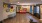 foyer with woof flooring and red couch