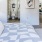 bedroom with a large bed and nightstand with lamp on it