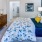 bedroom with a dresser, bed and large mirror