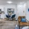 living area with a chair and dining table and chairs in the background