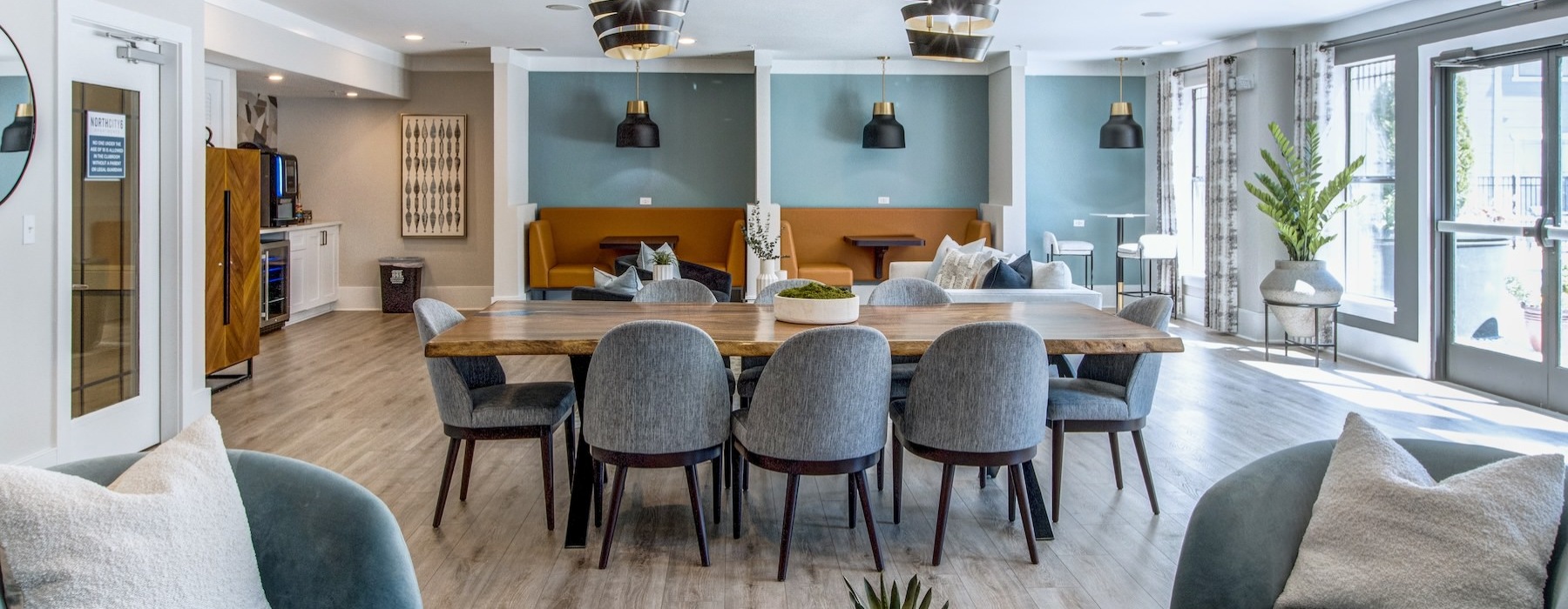 clubroom with a large table, chairs and windows