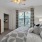 bedroom with large window and walk-in closet