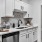 serving counter in kitchen with white cabinetry