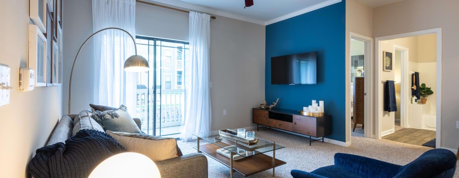 a living room with a blue wall